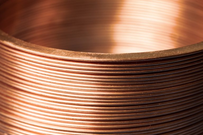 close-up-flat-twisted-copper-wire-factory-manufacture-components-electronic-household-appliances-office-equipment-concept-manufacturing-industrial-electronics-advertising-space