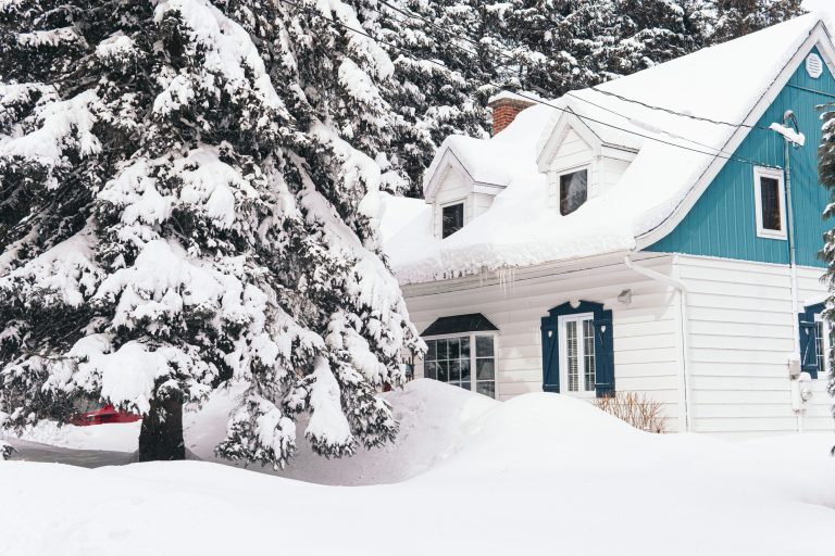 big-house-covered-with-white-snow-during-winter